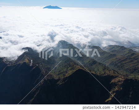 Aerial Mount Bromo Above Misty Mountain Clouds Aerial Mount Bromo Above Misty Mountain Clouds 142947214