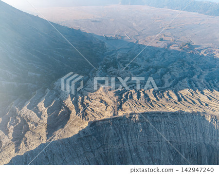 Volcanic crater reveals rugged, sunlit terrain Volcanic crater reveals rugged, sunlit terrain 142947240
