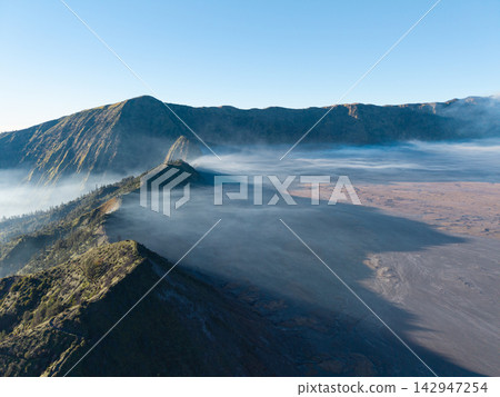 Aerial Mount Bromo Volcanic Landscape Above Misty Tengger Caldera Aerial Mount Bromo Volcanic Landscape Above Misty Tengger Caldera 142947254