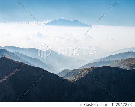 Mount Bromo Landscape Above Misty Volcanic Hills in Daylight Mount Bromo Landscape Above Misty Volcanic Hills in Daylight 142947258