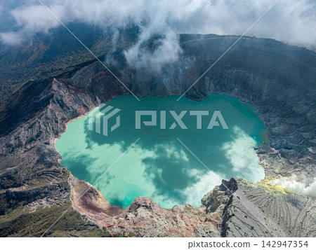 Aerial view of turquoise lake within volcanic crater Aerial view of turquoise lake within volcanic crater 142947354