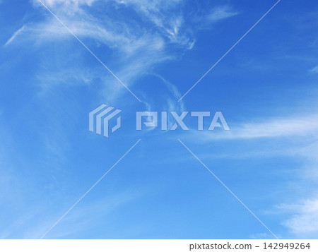 A clear blue sky and delicate, sprawling cirrus clouds. A clear blue sky and delicate, sprawling cirrus clouds. 142949264