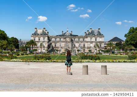 Woman on skateboard in front of Luxembourg Palace in Paris, France Woman on skateboard in front of Luxembourg Palace in Paris, France 142950411