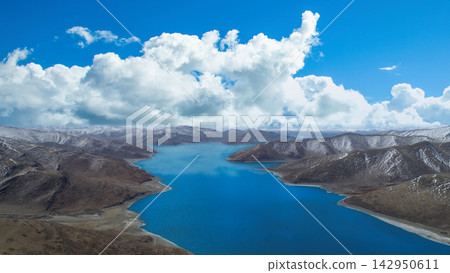 Panoramic View of a High Altitude Blue Lake Surrounded by Snow Capped Mountains in Tibet Panoramic View of a High Altitude Blue Lake Surrounded by Snow Capped Mountains in Tibet 142950611