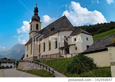 Traditional Bavarian Church in Ramshau Village, Germany with Alpine Mountains Traditional Bavarian Church in Ramshau Village, Germany with Alpine Mountains 142950647