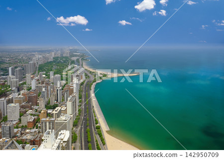 Aerial View of Chicago Skyline and Lake Michigan Beach on a Sunny Day Aerial View of Chicago Skyline and Lake Michigan Beach on a Sunny Day 142950709