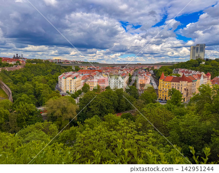 view of Prague's red-tiled roofs and historical buildings from Vysehrad fortress view of Prague's red-tiled roofs and historical buildings from Vysehrad fortress 142951244