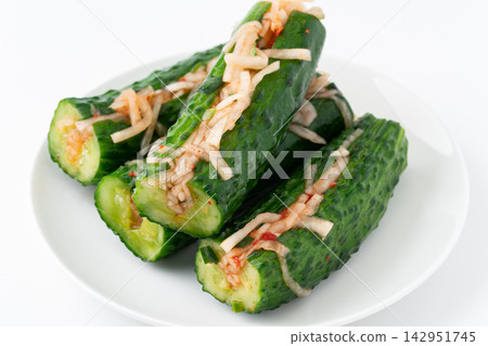 Oi Kimchi (cucumber kimchi) served against a white background. Oi Kimchi (cucumber kimchi) served against a white background. 142951745