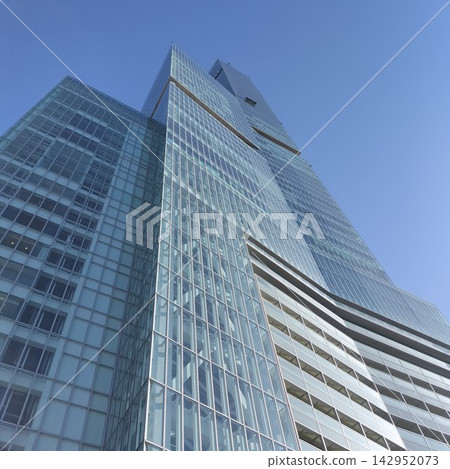 The Abeno Harukas skyscraper stands tall against the blue sky. The Abeno Harukas skyscraper stands tall against the blue sky. 142952073