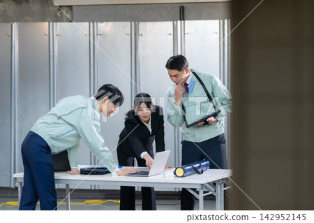 Architects meeting at a construction site Architects meeting at a construction site 142952145