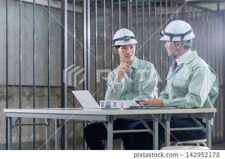 Architects meeting at a construction site Architects meeting at a construction site 142952178