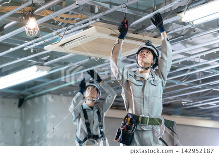 Electricians working on construction sites Electricians working on construction sites 142952187