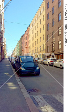 A colorful street scene in Copenhagen, Denmark, in May, under a clear blue sky. A colorful street scene in Copenhagen, Denmark, in May, under a clear blue sky. 142952467