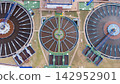 Aerial view of wastewater treatment plant with circular clarifiers, showcasing infrastructure, walkways, and operational facilities for urban water management solutions. 142952901