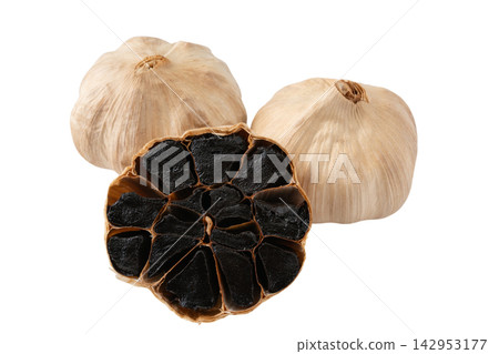 Cutout material of a cross-section of aged black garlic on a transparent background. Cutout material of a cross-section of aged black garlic on a transparent background. 142953177