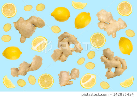 Fresh ginger root and lemons are artistically arranged on a bright blue background Fresh ginger root and lemons are artistically arranged on a bright blue background 142955454