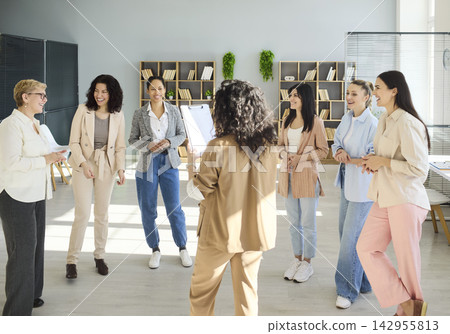 Diverse businesswomen team in office during coaching workshop discussion session 142955813