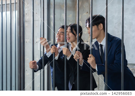 A businessman imprisoned in jail A businessman imprisoned in jail 142956083