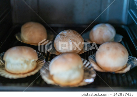 Homemade round bread baked in the oven Homemade round bread baked in the oven 142957433