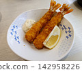 Two fried shrimp (with lemon and tartar sauce) Two fried shrimp (with lemon and tartar sauce) 142958226