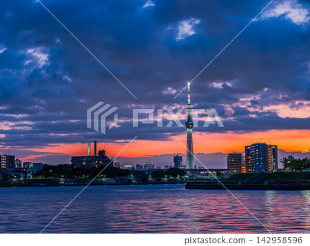 Evening view of Skytree and Nakagawa River dyed in the sunset Evening view of Skytree and Nakagawa River dyed in the sunset 142958596