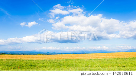 A refreshing blue sky and the autumn scenery of Biei town in Hokkaido and the Tokachi Mountain Range. A refreshing blue sky and the autumn scenery of Biei town in Hokkaido and the Tokachi Mountain Range. 142958611