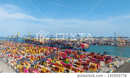 Aerial view container cargo ship terminal, Loading and Unloading crane of container cargo ship terminal, Industrial port with containers and container ship. Aerial view container cargo ship terminal, Loading and Unloading crane of container cargo ship terminal, Industrial port with containers and container ship. 142958736