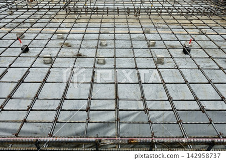 Building foundation work, rebar placement Building foundation work, rebar placement 142958737