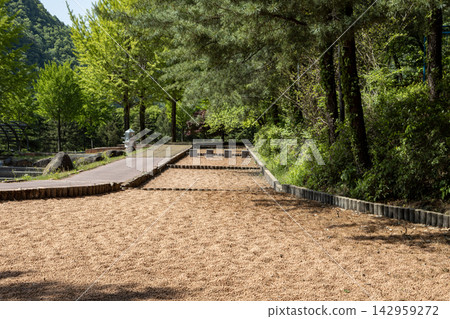 Barefoot-walking red clay path 142959272