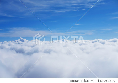 Beautiful Aerial view fluffy cloud and sky in heaven from window of airplane Beautiful Aerial view fluffy cloud and sky in heaven from window of airplane 142960819