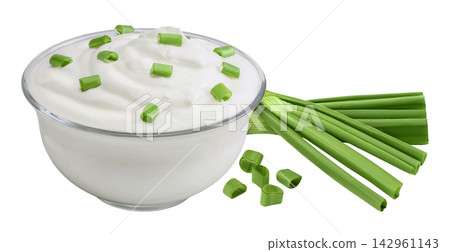 sour cream or yogurt in a glass bowl with green onion isolated on white background with full depth of field sour cream or yogurt in a glass bowl with green onion isolated on white background with full depth of field 142961143