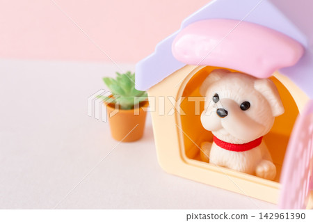 A dog sitting in a pet house/kennel. A dog sitting in a pet house/kennel. 142961390