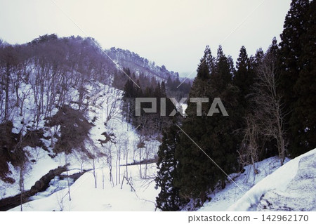 Winter scenery viewed from the mountain road leading to Ginzan Onsen Winter scenery viewed from the mountain road leading to Ginzan Onsen 142962170