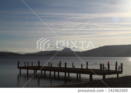 Old abandoned wooden fishing pier on the river in the countryside Old abandoned wooden fishing pier on the river in the countryside 142962895