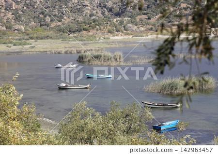 Fishing boats moored along the shore of Lake Bafa in Turkey. Selective Focus. 142963457