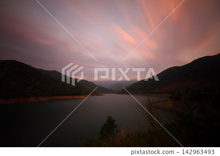 Flowing river in the forest, long exposure Flowing river in the forest, long exposure 142963493