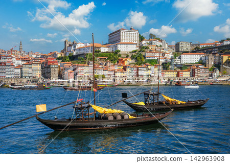 Porto rabelo boats on Douro River by Ribeira, Gaia waterfront view Porto rabelo boats on Douro River by Ribeira, Gaia waterfront view 142963908