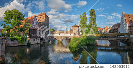 Panoramic view of Pegnitz river with Henkersteg and Weinstadel in Nuremberg Panoramic view of Pegnitz river with Henkersteg and Weinstadel in Nuremberg 142963911