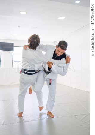 Black belt BJJ athletes entering an uchi-mata throw Black belt BJJ athletes entering an uchi-mata throw 142963948