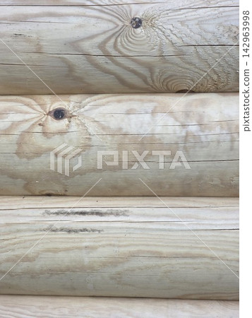 Smooth wooden logs stacked wall texture background Smooth wooden logs stacked wall texture background 142963998