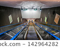 A long escalator leading to the underground platform of the Yokosuka Line inside Shimbashi Station. 142964282