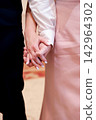 Married Couple's Hands with Elegant Ring and White Polish 142964302