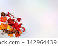 Abstract autumn composition featuring maple leaves, pine cones, nuts, cinnamon, star anise, dried orange slices and rowan berries.Vibrant, beautiful banner and Hello Autumn greeting card 142964439