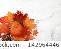Seasonal banner featuring maple leaves and pumpkins Thanksgiving themed still life or website header, abstract autumn composition for greeting card or invitation with copy space, 142964446