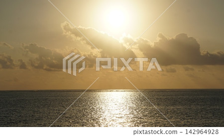 The sunrise over the sea, a ray of hope. The sunrise over the sea, a ray of hope. 142964928