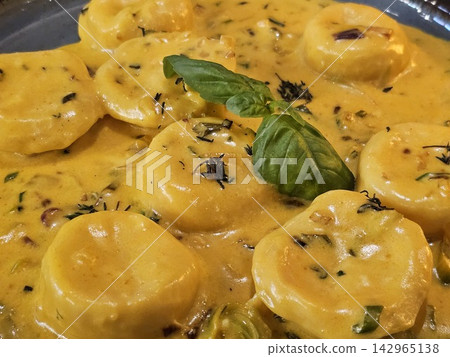 Close View of Sorrentinos in Creamy Herb Sauce Close View of Sorrentinos in Creamy Herb Sauce 142965138