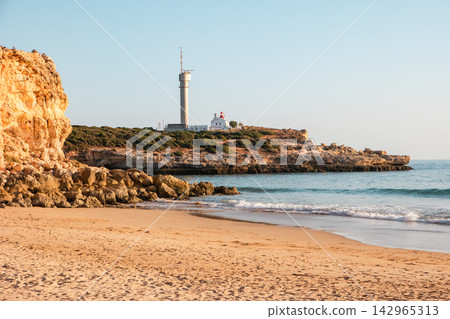 Ponta do Altar lighthouse on cliff in Ferragudo Ponta do Altar lighthouse on cliff in Ferragudo 142965313