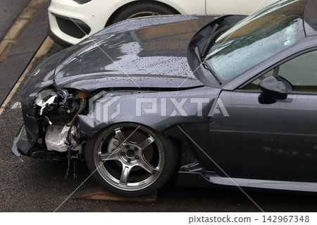 Sports car with damage to the front Sports car with damage to the front 142967348