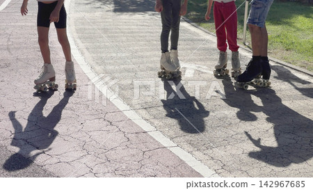 Roller skates family park activity background. Quad skating lesson outdoor summer recreation. Fun family hobby active lifestyle backdrop. Roller skates family park activity background. Quad skating lesson outdoor summer recreation. Fun family hobby active lifestyle backdrop. 142967685