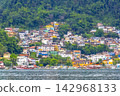 Mountains with favelas houses tropical nature Angra dos Reis Brazil. 142968133